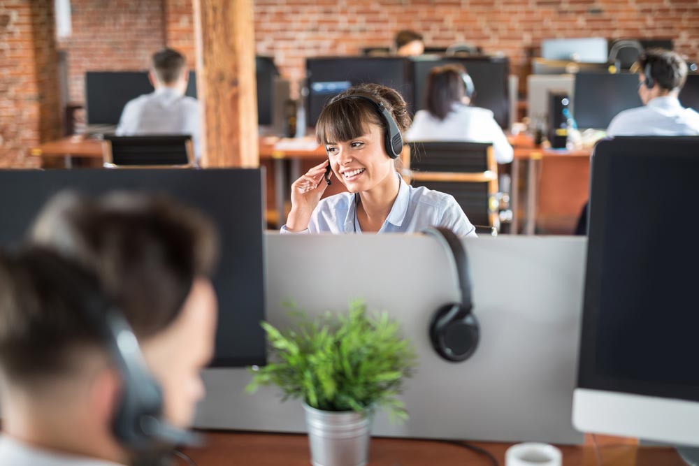 Call center worker accompanied by her team