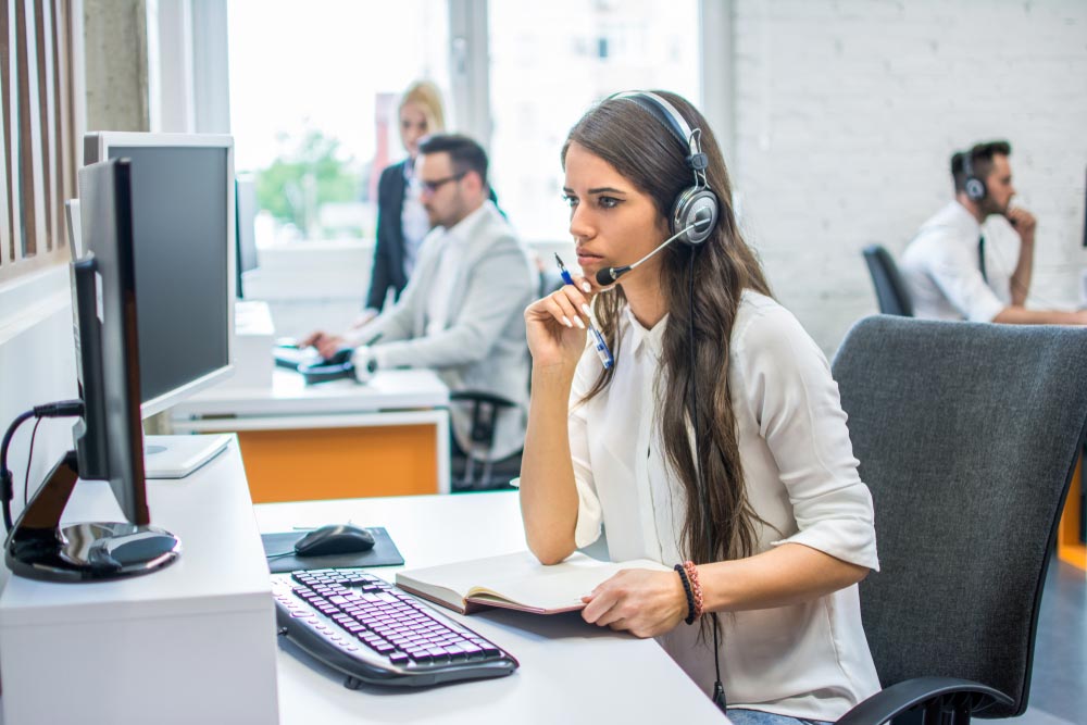 Pensive young attractive business woman