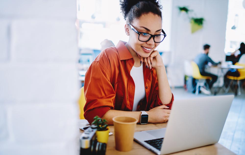 girl enjoying friendly video call on laptop